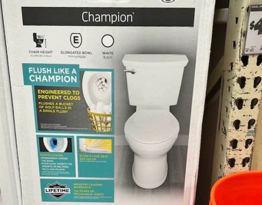 image: toilet box on a hardware store shelf. image on box of flushed golf balls. text on box reads: "Flush like a champion."